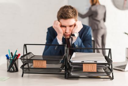 Person at desk reflecting